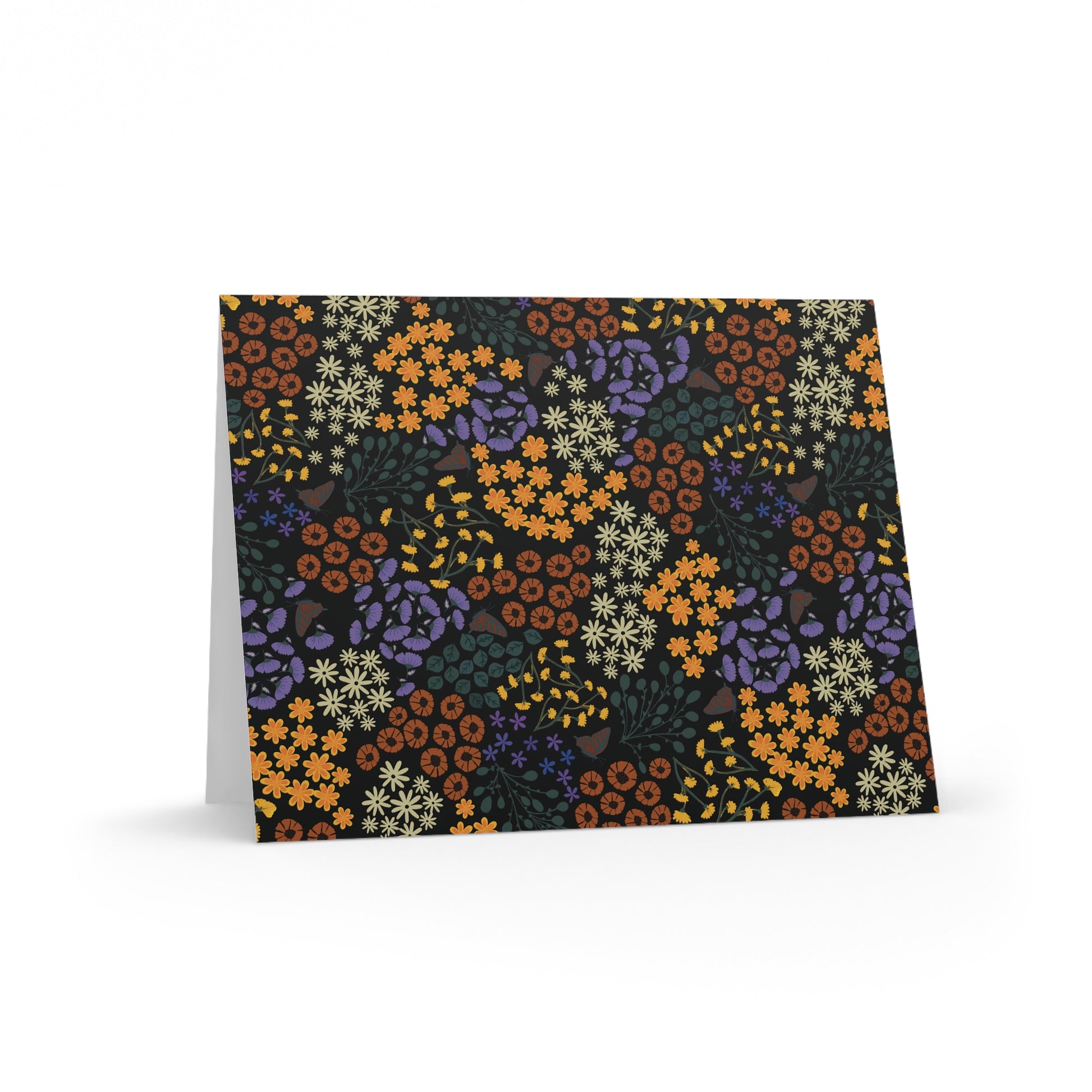 Floral Greeting Cards — Pack of 8/16/24: A folded card with a vibrant floral pattern of stylized blooms and leaves, set against a dark backdrop, ready for personalized messages. Includes a matching white envelope.