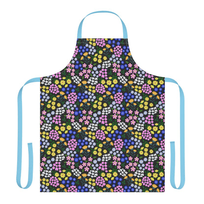 Apron Floral Design features a vibrant floral pattern on a black background, with light blue ties. Made from 100% polyester canvas, it's stain-free and comfortable, perfect for cooking or crafting.