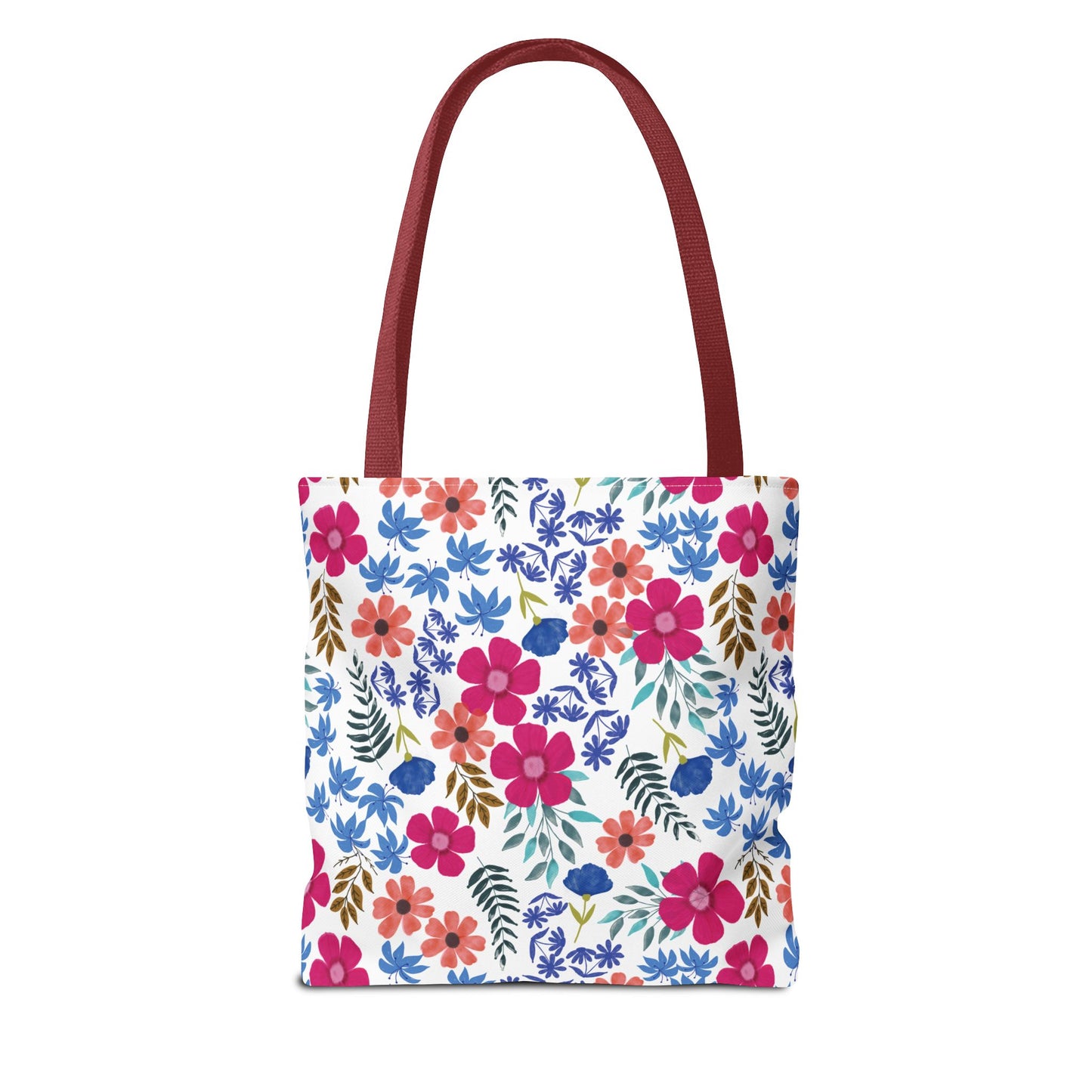 Confetti Wildflower Tote Bag with dark-red handles and a vibrant floral pattern, featuring pink, coral, blue flowers, and green leaves. Ideal for joyful summer outings or beach trips.