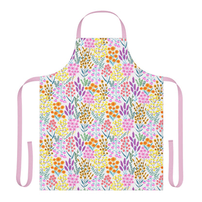 Floral Apron featuring a vibrant wildflower print on a white background with pale pink ties, crafted from 100% polyester canvas for comfort and stain-free wear, ideal for joyful cooking and crafting.