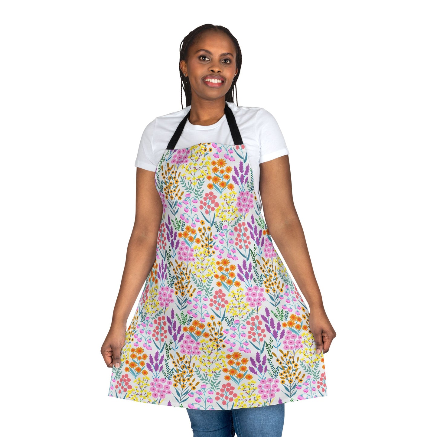 Floral Apron modeled against a white background, featuring vibrant pink, yellow, orange, and purple flowers. Ideal for cooking or crafting, it offers style and comfort with its stain-free, soft polyester fabric.