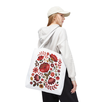 Red Floral Folk-Art Style Tote Bag featuring organic red-toned floral illustrations with bold, delicate flowers and green leaves. Available in multiple sizes, perfect for carrying essentials with style and durability.