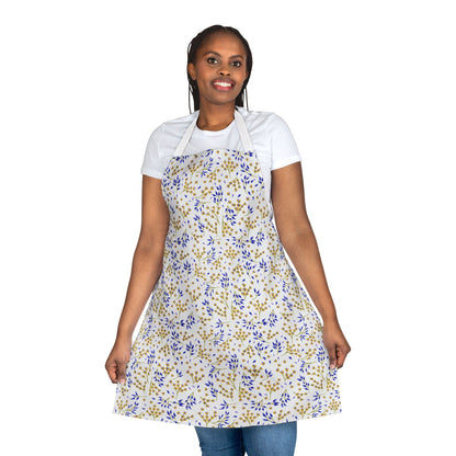 Person with long braided hair wearing a Floral Apron, featuring yellow and blue leafy motifs on an off-white background, showcasing its full shape; ideal for baking, cooking, and crafting.