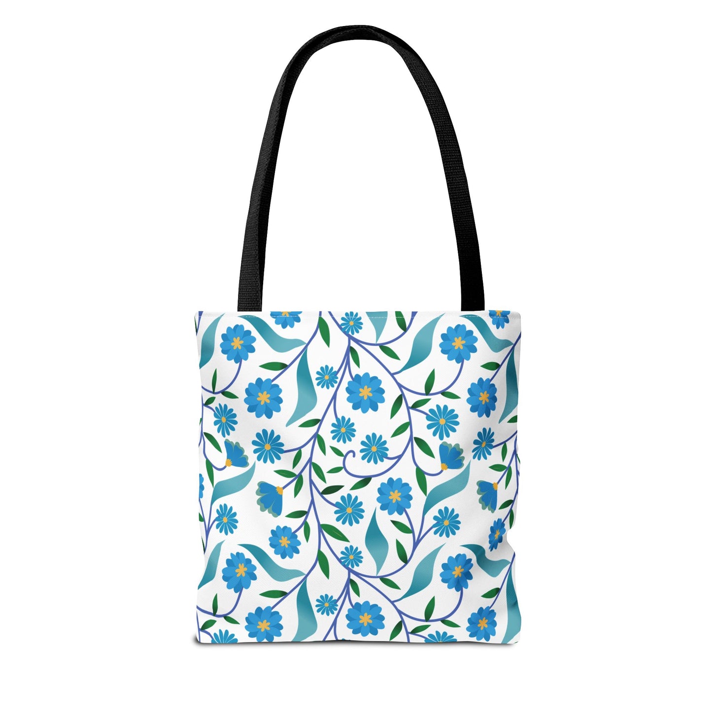 Blue Floral Tote Bag featuring a vibrant botanical pattern with stylized blue flowers, yellow centers, and green leaves on a durable white canvas. Black straps offer strength and style, perfect for cheerful summer outings.