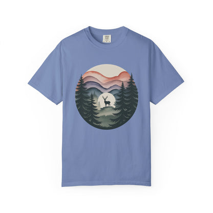 Nature Wanderer T-Shirt features a serene sage-green with mountain silhouettes, celestial moon, and a minimalist stag, embodying wilderness and tranquility, perfect for nature lovers seeking comfort and style.