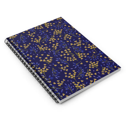 Floral Spiral Notebook with a navy cover adorned with yellow and violet-blue botanical motifs. Features durable black metal binding, ideal for creative note-taking and journaling. Perfect for students and professionals.
