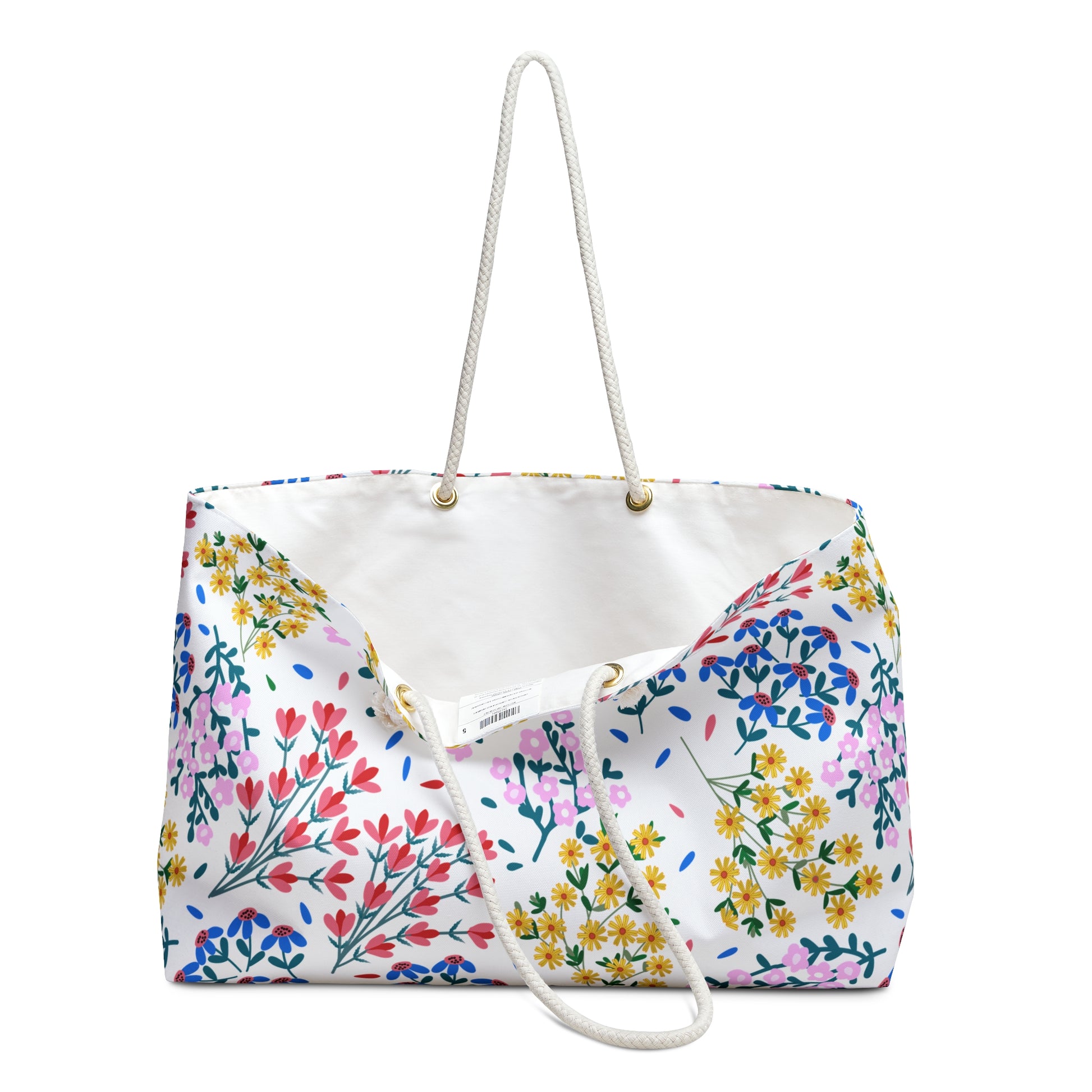 Weekender Bag with rope handles, featuring a vibrant floral pattern on white canvas, perfect for stylish travel. This spacious tote, with its open top, offers easy access and ample storage.