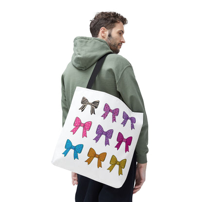 Man holding Bows Ribbons Tote Bag adorned with playful bow designs, ideal for fashion enthusiasts seeking a spacious, stylish, and practical accessory for everyday adventures.