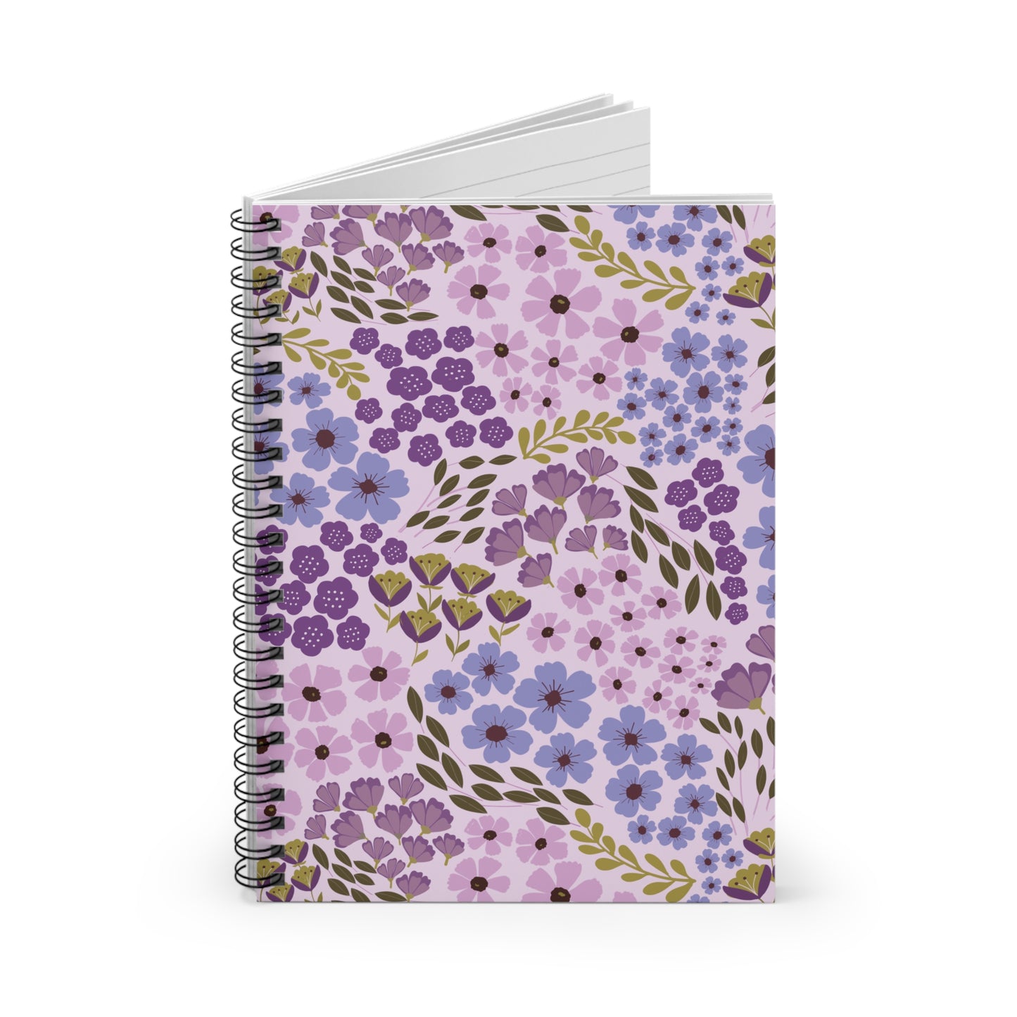 Floral Spiral Notebook showcasing a vibrant floral design with purple, lilac, and blue flowers on a pale lavender cover, slightly open to reveal blank pages, embodying FireBrook Designs' stylish and joyful essence.
