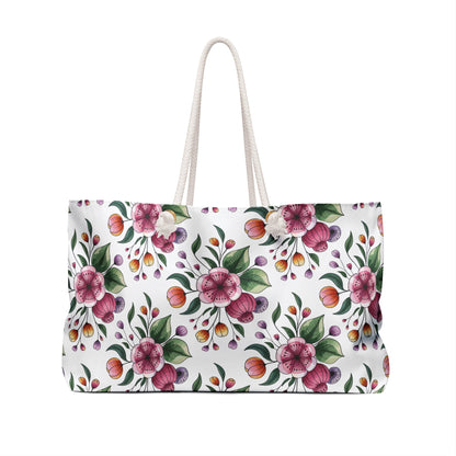 Botanical Weekender Bag with a vibrant floral and leaf design, featuring durable rope handles and a spacious interior, perfect for adding whimsy to your travel adventures.