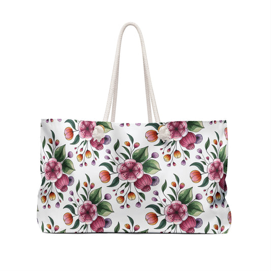 Botanical Weekender Bag with a vibrant floral and leaf design, featuring durable rope handles and a spacious interior, perfect for adding whimsy to your travel adventures.