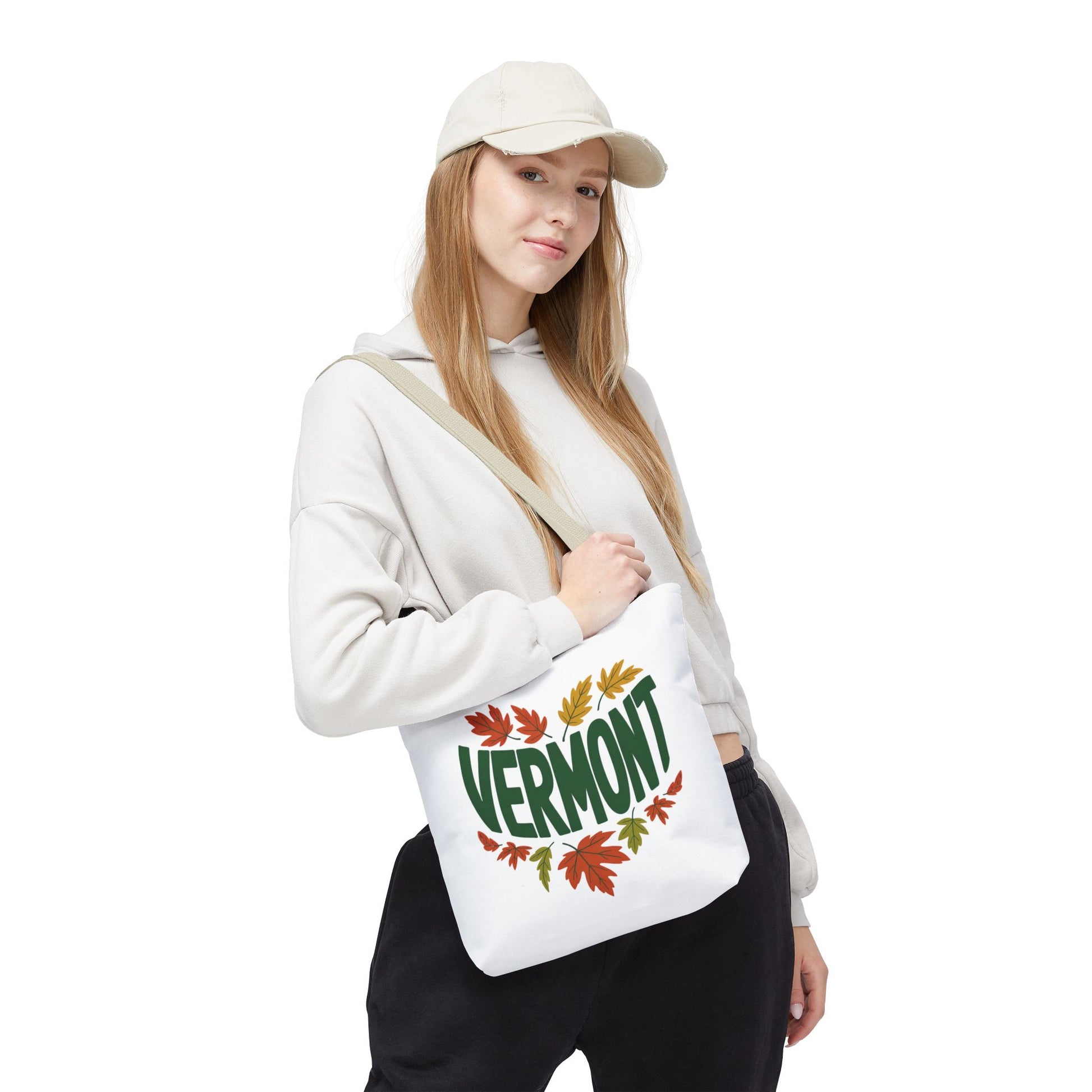 A person casually holds the Vermont Tote Bag, showcasing its durable polyester material and reinforced stitching. Ideal for daily essentials, aligning with FireBrook Essentials' blend of style and practicality.