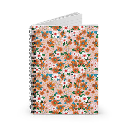 Floral Spiral Notebook featuring a decorative peach cover with vibrant orange, white, and teal blossoms, standing upright with visible metal coils and lined pages, embodying FireBrook Designs' joyful, uplifting style.