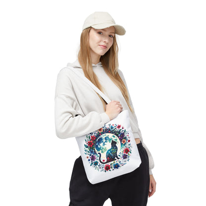 Lone Cat Under the Moon Tote Bag features a whimsical cat design, perfect for feline enthusiasts. Crafted from durable polyester with reinforced handles, it's ideal for errands or beach trips, embodying FireBrook Essentials' uplifting style.