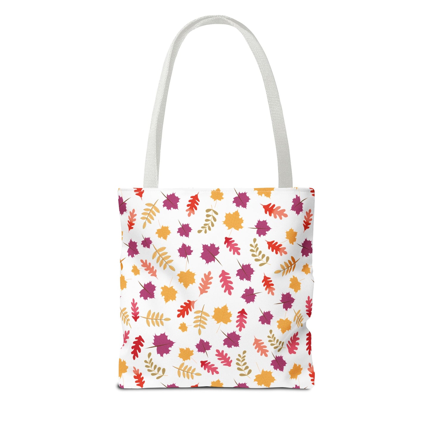 Autumn Leaves Tote Bag featuring a vibrant pattern of scattered autumn-style leaves in orange, gold, red, and purple on a white canvas, ideal for stylishly carrying everyday essentials.