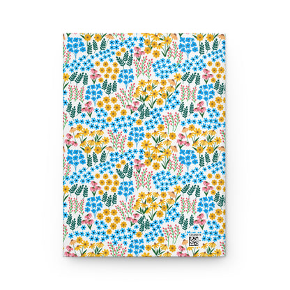 HARDCOVER JOURNAL, MATTE, RULED, 5X7, SEWN BIND, CLEAN-TEAR PAGES – WILDFLOWER MEADOW MIX features a vibrant, seamless floral pattern on a matte cover, embodying FireBrook Designs' uplifting aesthetic.