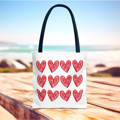 Hearts Tote Bag by FireBrook Designs: A stylish white tote adorned with red hearts, perfect for adding charm and joy to everyday outfits. Durable with reinforced handles, ideal for gifts and daily use.