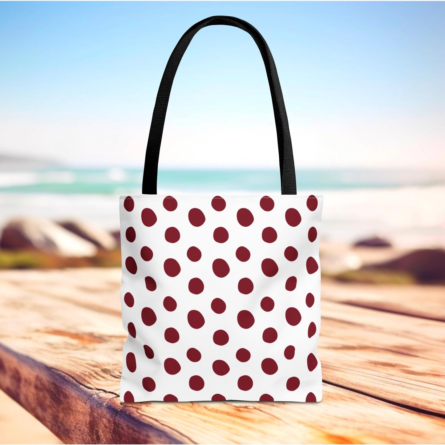 Burgundy Polka Dots Tote Bag with black handles, offering durability and classic charm. Perfect for everyday use, this tote embodies FireBrook's uplifting and stylish design ethos. Ideal for shopping and travel.
