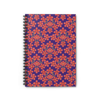 Floral Spiral Notebook with vibrant red-orange flowers on a purple cover, featuring durable black metal binding. Ideal for creative journaling or note-taking, reflecting FireBrook Designs' uplifting style.