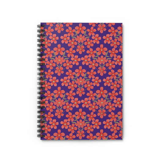 Floral Spiral Notebook with vibrant red-orange flowers on a purple cover, featuring durable black metal binding. Ideal for creative journaling or note-taking, reflecting FireBrook Designs' uplifting style.