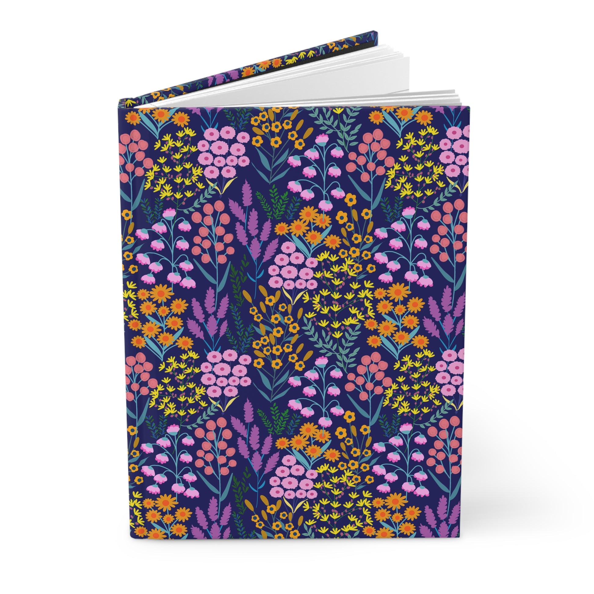 HARDCOVER JOURNAL, MATTE, RULED, 5X7, SEWN BIND, CLEAN-TEAR PAGES - FLORAL MEADOWS, BLUE BACKGROUND, featuring a dense floral design, stands upright with slightly fanned pages showcasing its quality craftsmanship.