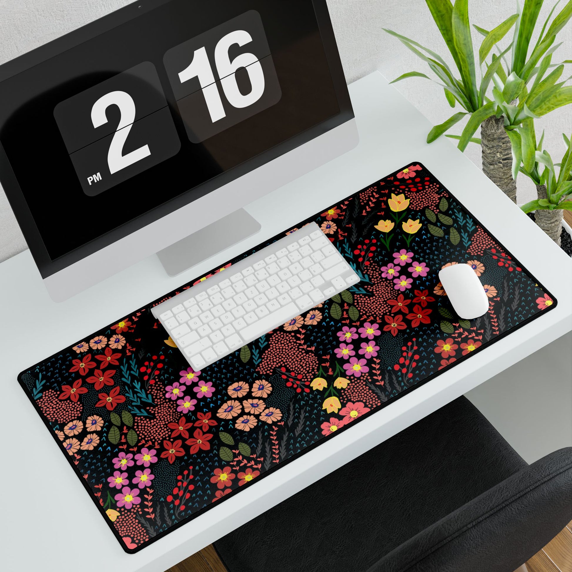 Desk Mat - Midnight Garden Floral Pattern featuring a vibrant floral design on a sleek black background, complemented by a wireless keyboard and mouse, perfect for enhancing any modern desk setup.