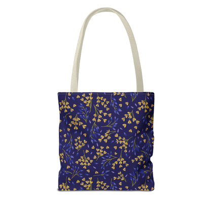 Floral Tote Bag with navy-blue body, adorned with yellow-gold botanical patterns and off-white straps—perfect for joyful summer outings, reflecting FireBrook Essentials’ uplifting and stylish design philosophy.