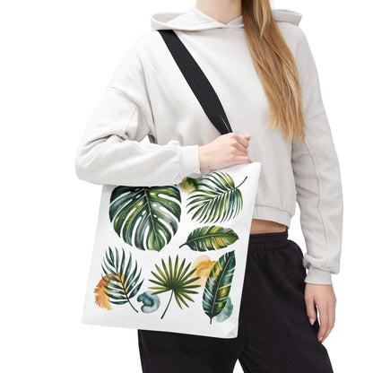 Tropical Leaves Tote Bag showcases a vibrant leaf pattern, embodying a fresh, summery vibe. Its durable, spacious design with reinforced handles makes it ideal for beach trips and everyday adventures.