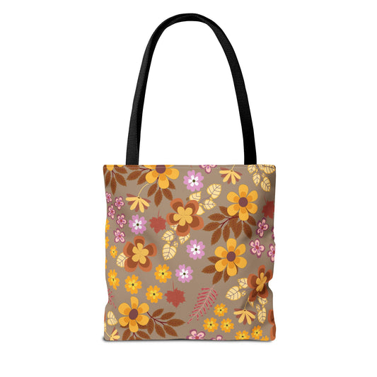 Harvest Brown Bloom Tote Bag with black straps, featuring a vibrant floral pattern in warm tones on a taupe background. Ideal for summer outings, it's a durable, stylish accessory from FireBrook Designs.
