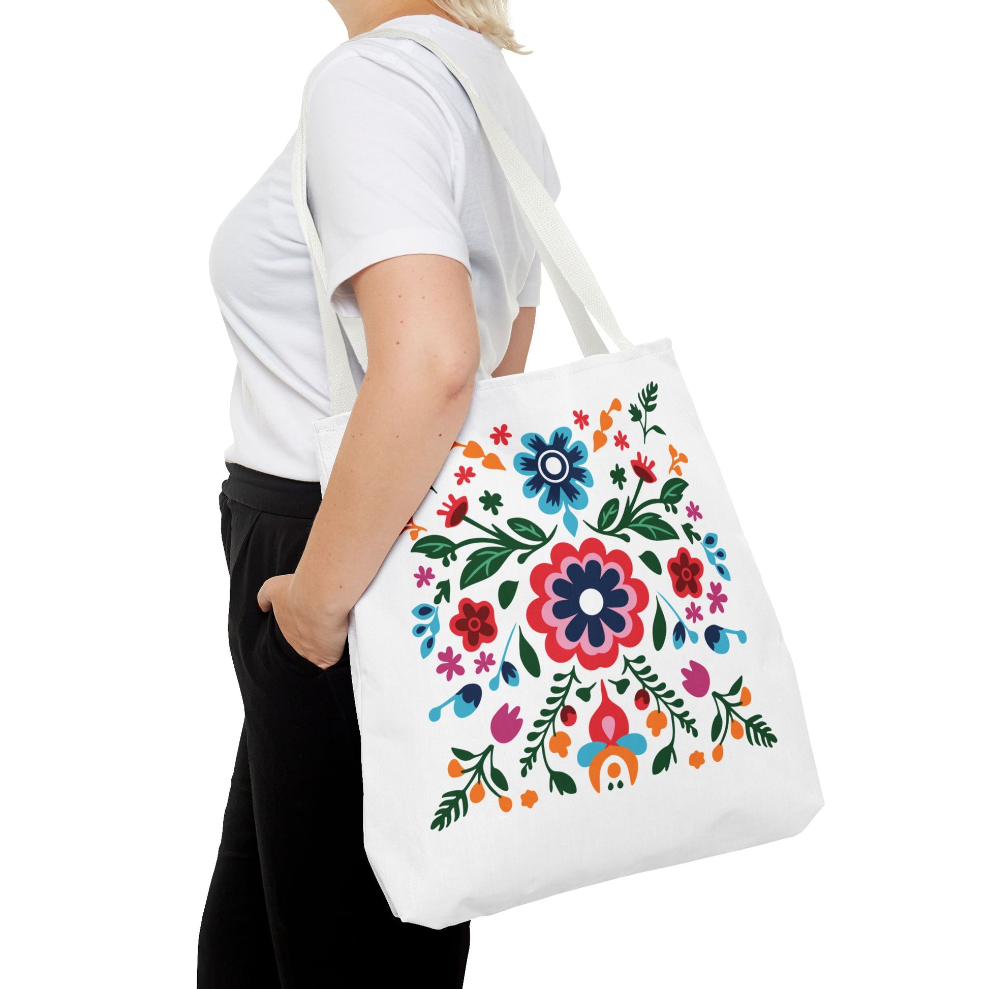 Woman holding the Floral Tote Bag, featuring a colorful flower design, perfect for stylish, practical use.