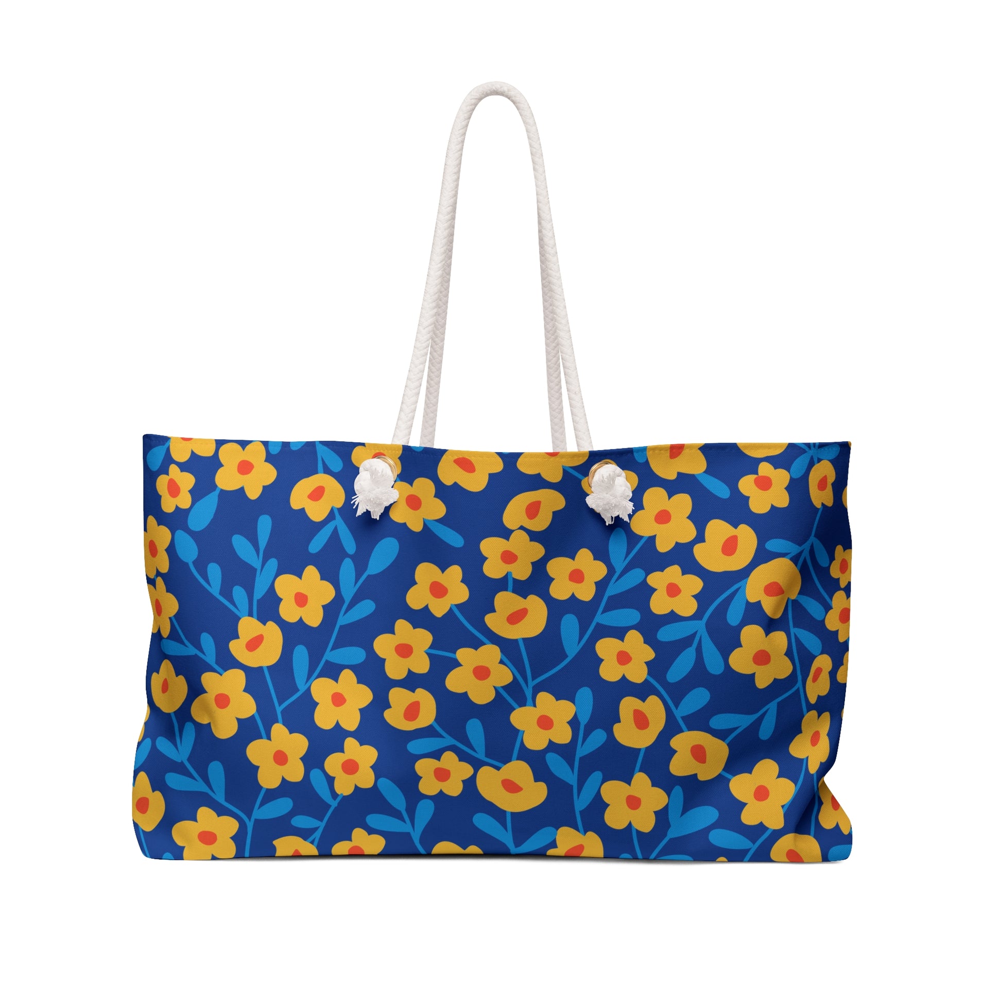 Weekender Bag featuring a deep blue canvas-style design with a yellow floral pattern, thick white rope handles, and a cream interior, ideal for stylish, joyful travel experiences.