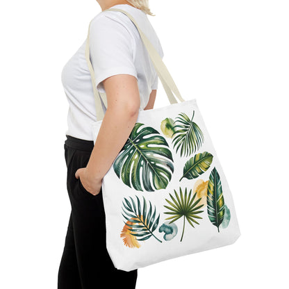 The Tropical Leaves Tote Bag features vibrant leaf patterns, showcasing a fresh, summery style. Designed for durability and spaciousness, it embodies FireBrook Designs' commitment to stylish, joyful, and practical fashion accessories.