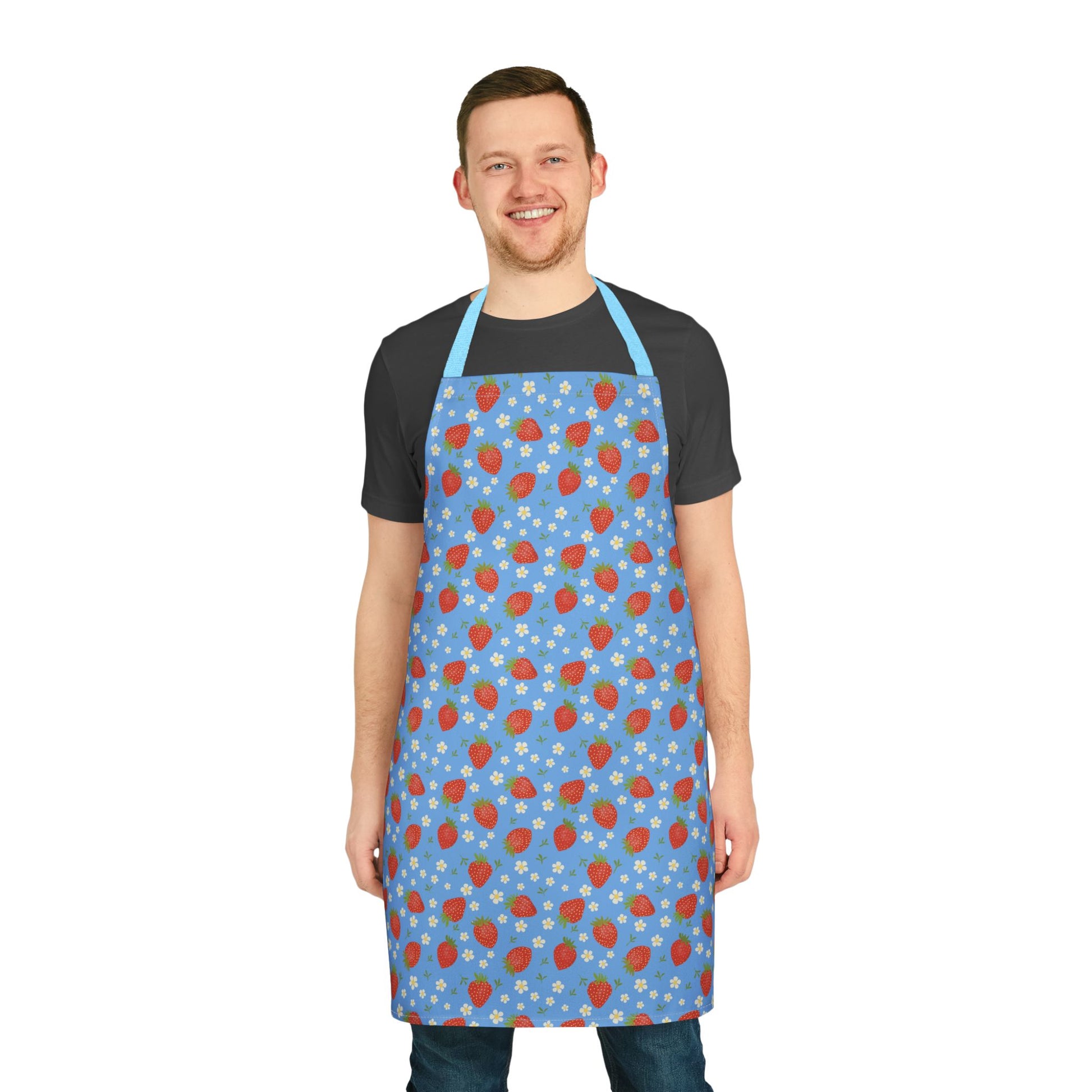 Man smiling while wearing the Apron, Strawberry 5-Color Straps, showcasing its vibrant strawberry pattern and practical design, ideal for cooking enthusiasts seeking style and functionality.