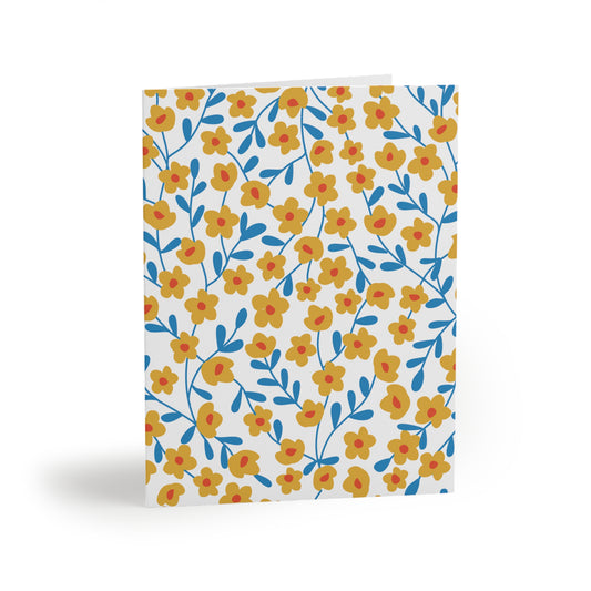 Floral Greeting Cards — Pack of 8/16/24 feature hand-drawn mustard-yellow flowers with red centers on blue stems, providing a cheerful, springtime vibe; ideal for heartfelt notes.