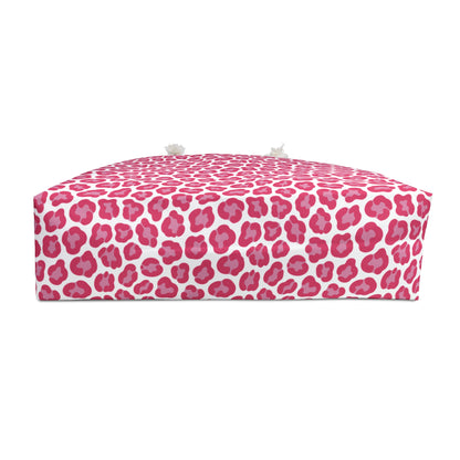 Cheetah Weekender Bag featuring a bold pink and white pattern, ideal for stylish travel. Equipped with cream-colored rope handles and a T-bottom design, perfect for adventurous getaways.