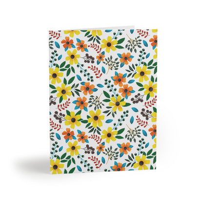 Floral Greeting Cards — Pack of 8/16/24, featuring vibrant, hand-drawn wildflowers and foliage on a matte-finish, folded card. Perfect for sending cheerful, personalized messages, each card includes a matching envelope.