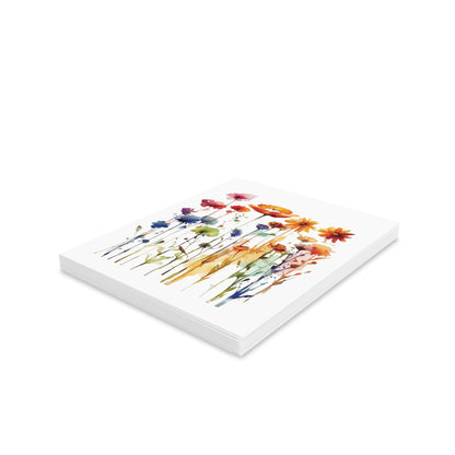 Wildflowers Greeting Cards — Pack of 8/16/24, featuring vibrant watercolor wildflowers in reds, oranges, and blues, stacked with matching white envelopes. Perfect for spreading joy and positivity from FireBrook Designs.