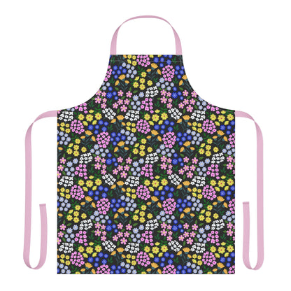 Apron Floral Design: Full-coverage kitchen apron with colorful floral pattern on black, pastel pink straps. Made of soft, stain-free polyester canvas, ideal for cooking or crafting, reflecting FireBrook Essentials' joyful style.