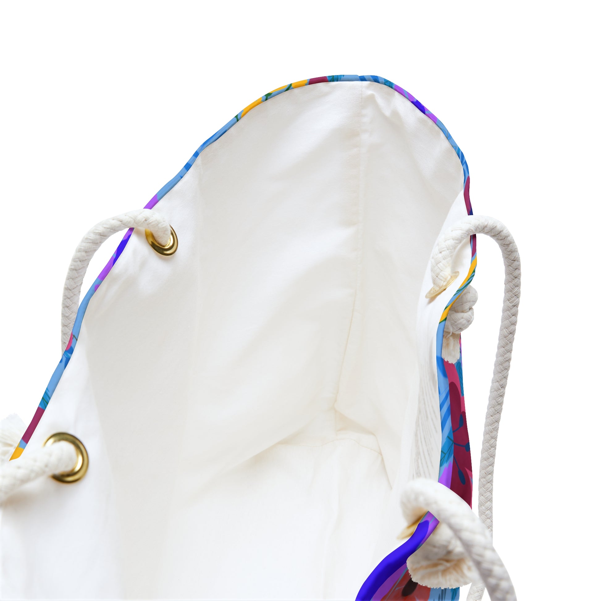 Weekender Bag with braided rope handles through brass eyelets, featuring an off-white interior and vibrant patterned trim, ideal for stylish weekend getaways, reflecting FireBrook Designs' uplifting and practical approach.