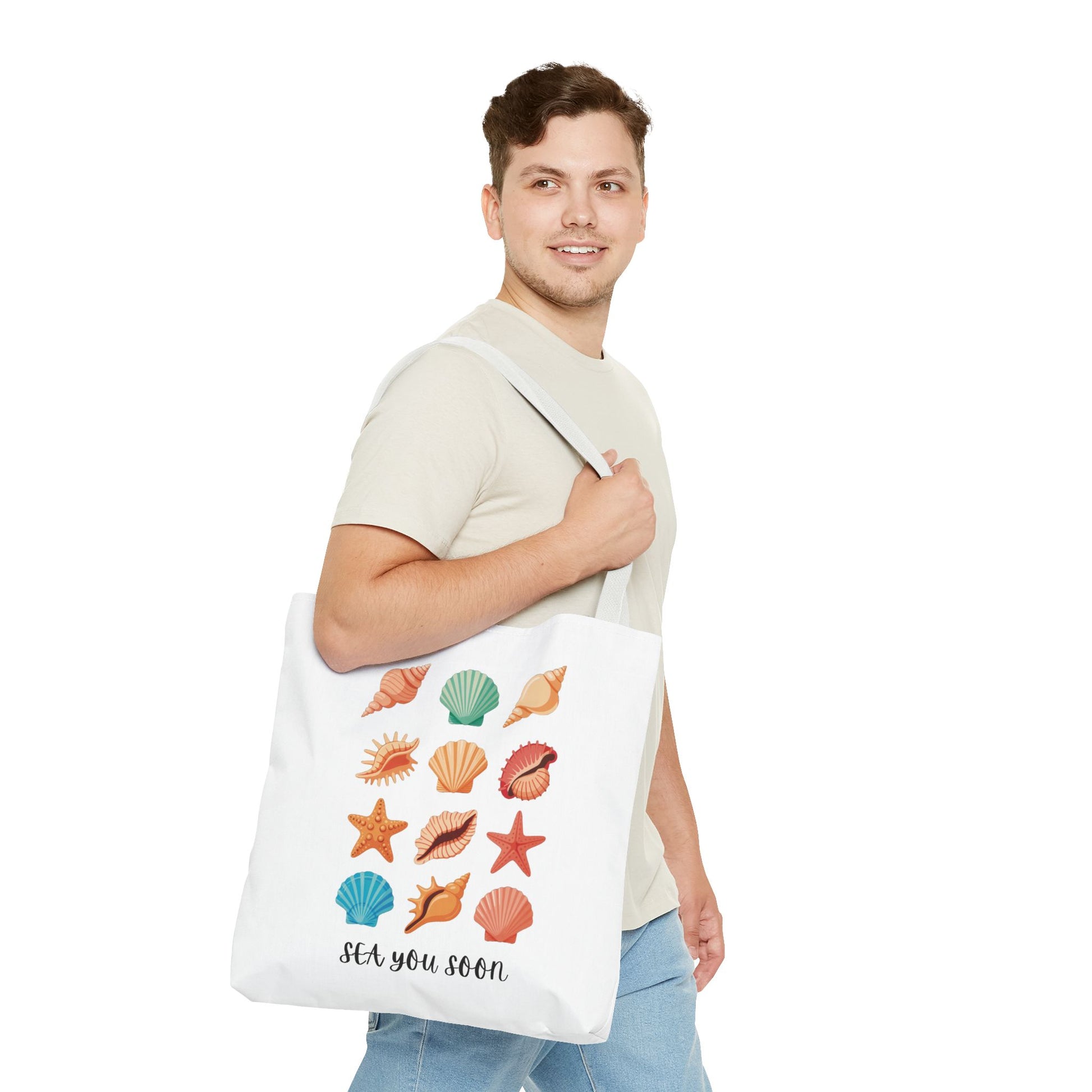 Sea You Soon Sea Shells Tote Bag featuring a beachy design with seashells, ideal for beach trips or casual outings. Durable polyester with reinforced handles, embodying FireBrook Essentials' joyful and uplifting style.