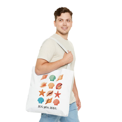 Sea You Soon Sea Shells Tote Bag featuring a beachy design with seashells, ideal for beach trips or casual outings. Durable polyester with reinforced handles, embodying FireBrook Essentials' joyful and uplifting style.