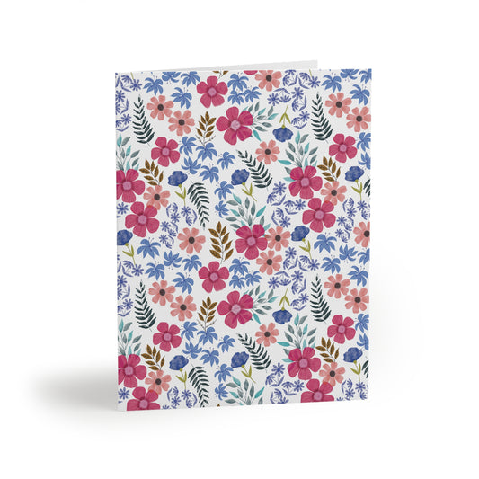 Floral Wildflower Greeting Cards — Pack of 8/16/24 features a vibrant watercolor floral pattern, conveying a fresh, springtime energy. Ideal for heartfelt messages, each card comes with a matching envelope.