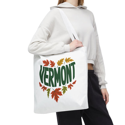 Close-up of a hand holding the Vermont Tote Bag, showcasing its durable design with reinforced stitching and spacious boxed corners, ideal for carrying essentials.