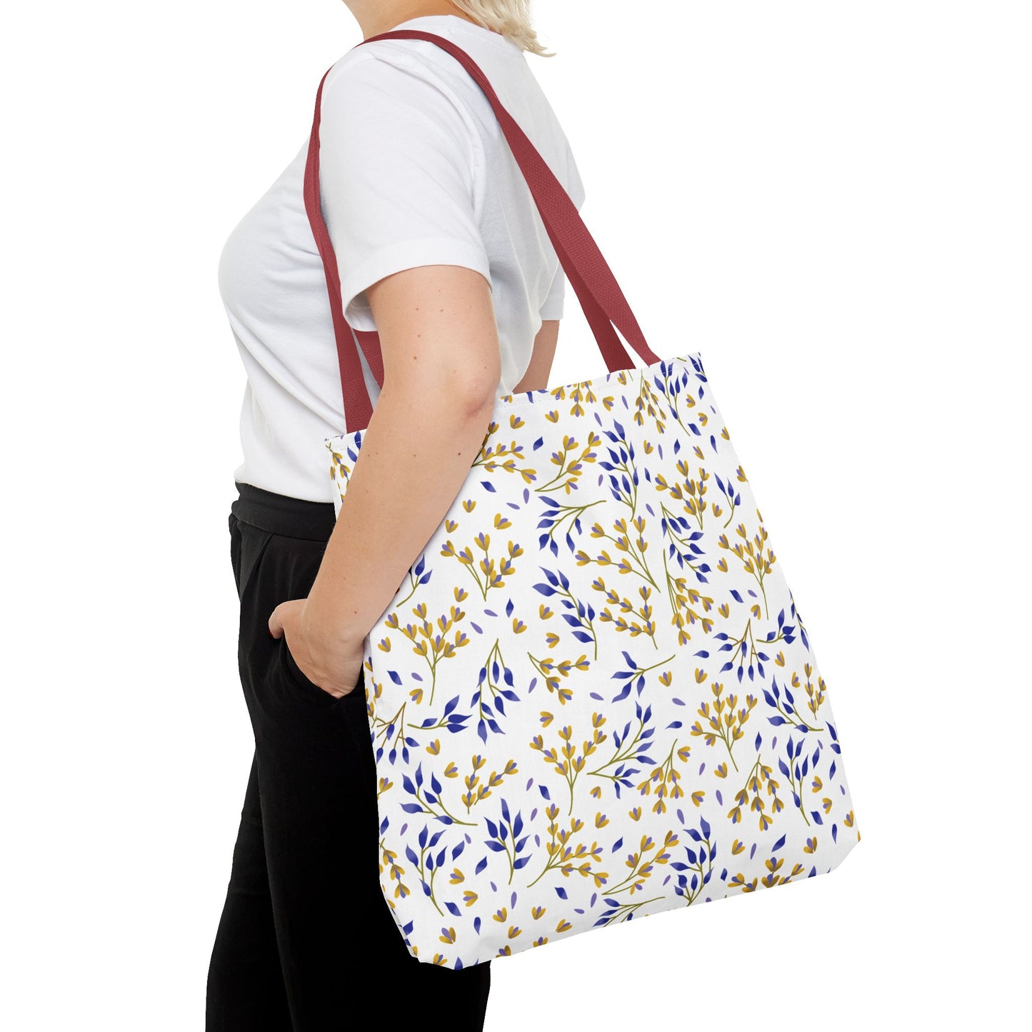 Floral Tote Bag with vibrant yellow-gold and blue leaf pattern, perfect for summer outings. Features sturdy reddish-brown straps, durable polyester body, and reinforced stitching for strength and style.