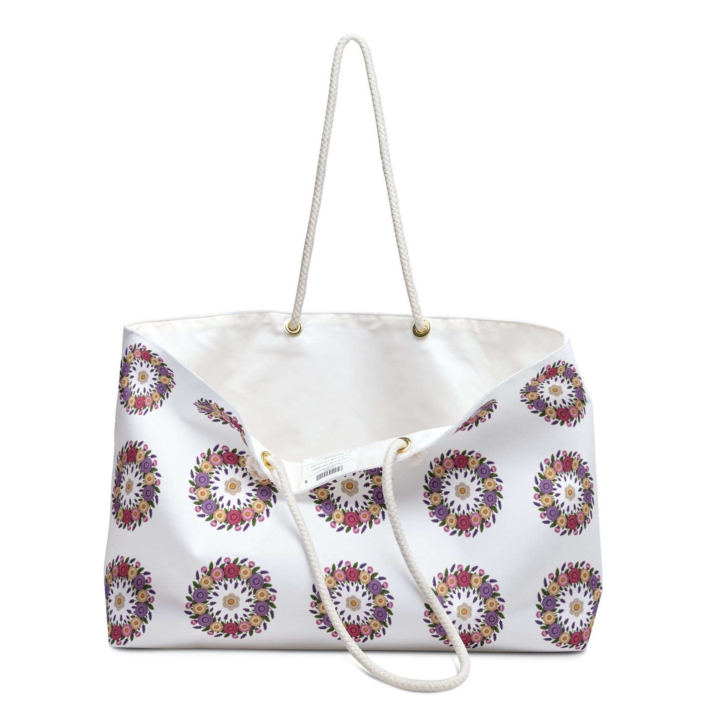 Crochet Floral Weekender Bag with intricate crochet floral pattern, cream background, and cotton rope handles. Ideal for stylish travel, aligning with FireBrook Designs' commitment to uplifting, joyful, and practical fashion accessories.