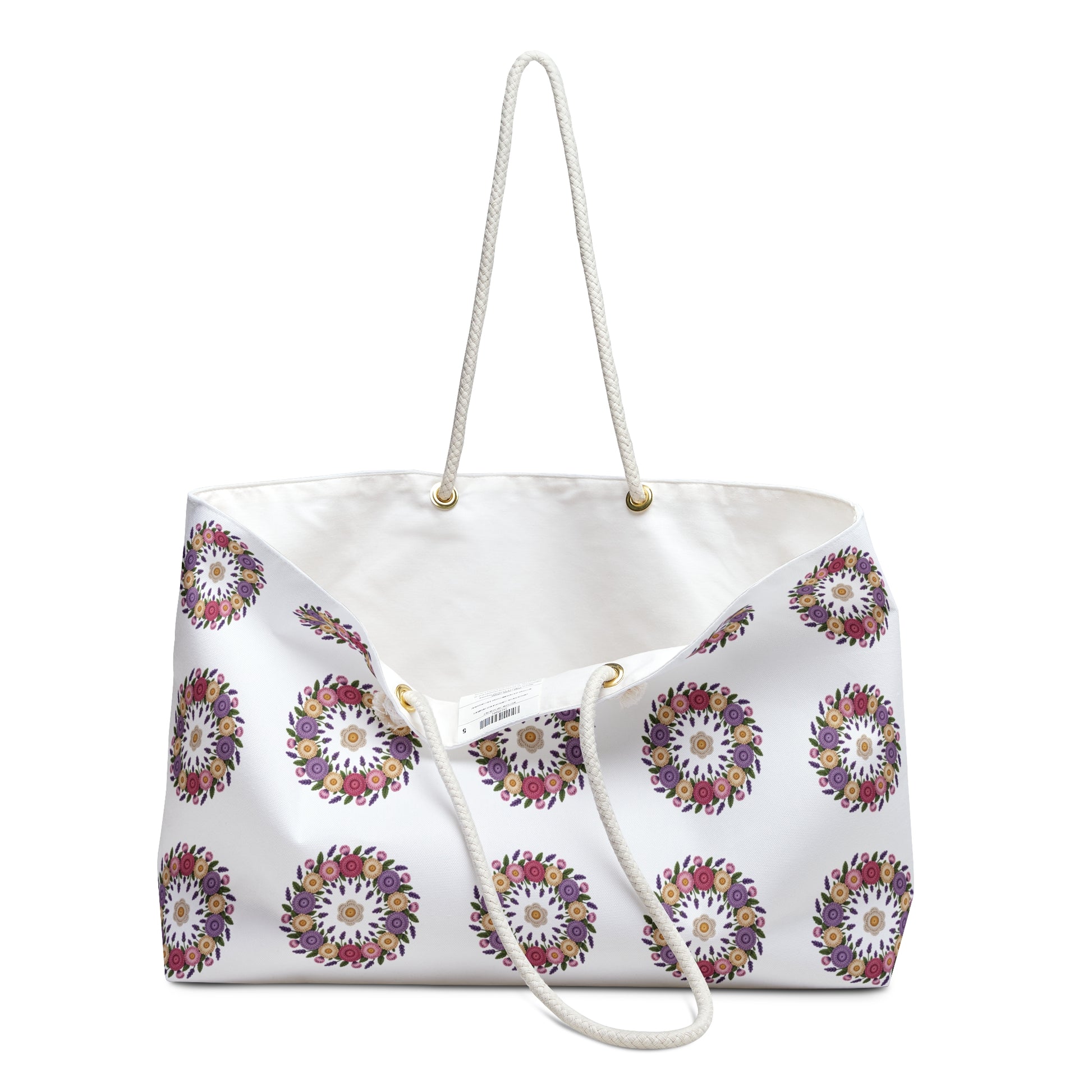Crochet Floral Weekender Bag with intricate crochet floral pattern, cream background, and cotton rope handles. Ideal for stylish travel, aligning with FireBrook Designs' commitment to uplifting, joyful, and practical fashion accessories.