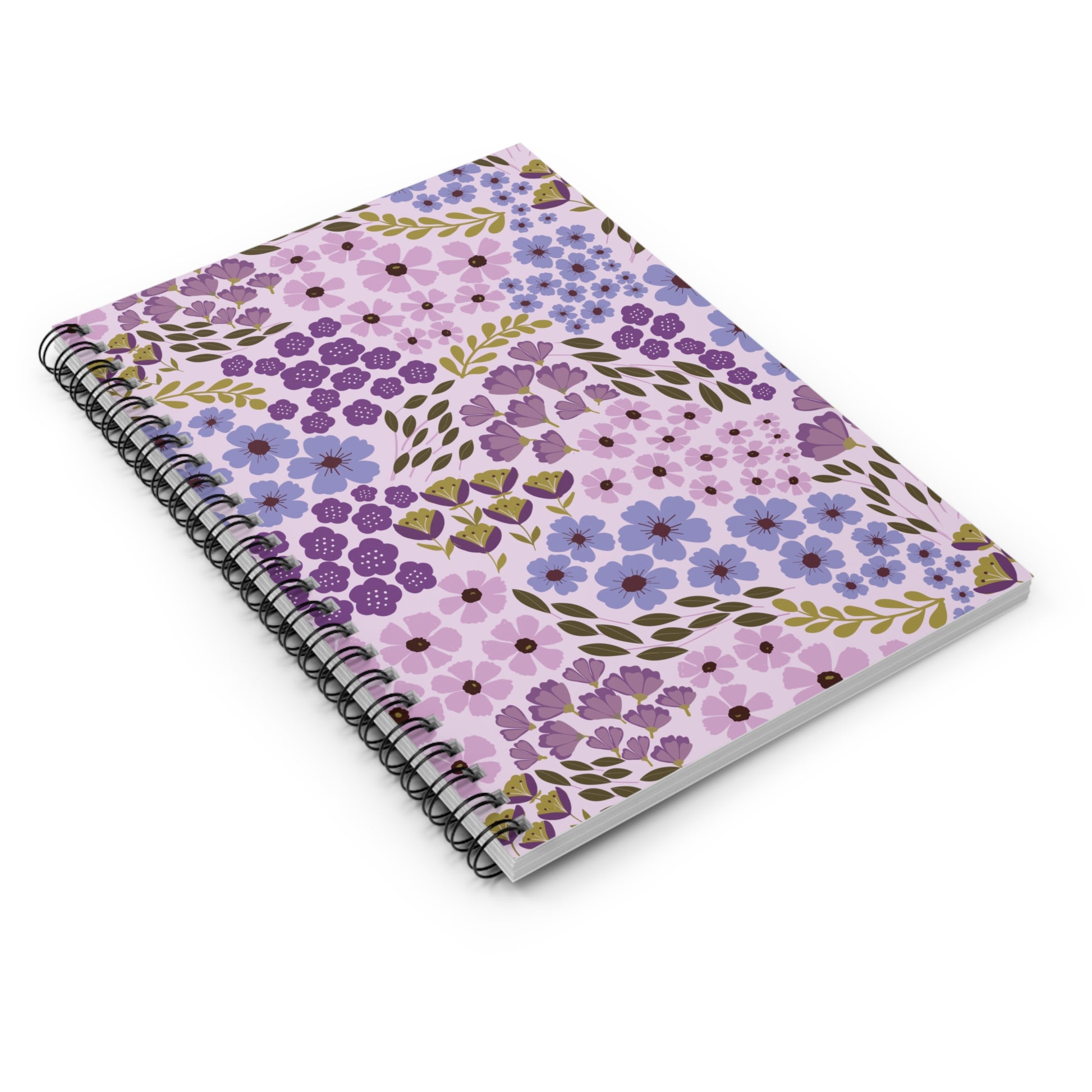 Floral Spiral Notebook with vibrant purple and green floral pattern on a light pink cover, featuring sleek metal spiral binding, ideal for jotting down notes and sparking creativity.