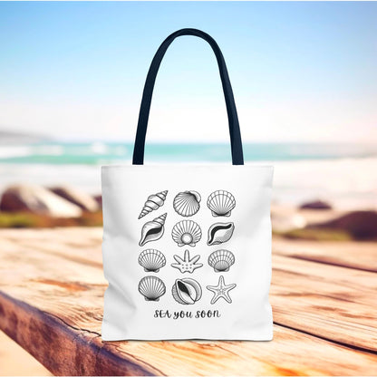 Sea Shells Tote Bag featuring a beachy design. Made from durable polyester with reinforced stitching, it’s a practical accessory for beach trips, reflecting FireBrook Essentials' joyful and uplifting style.