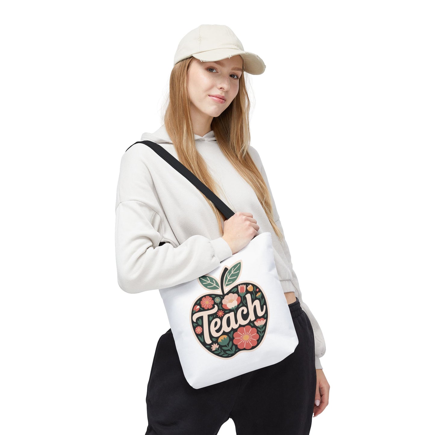 Floral Apple Tote Bag - Hand-Drawn Pastel-Colored Design with 'TEACH', showcasing a playful apple shape adorned with delicate florals. Ideal for teachers, offering both style and functionality with reinforced handles and spacious interior.