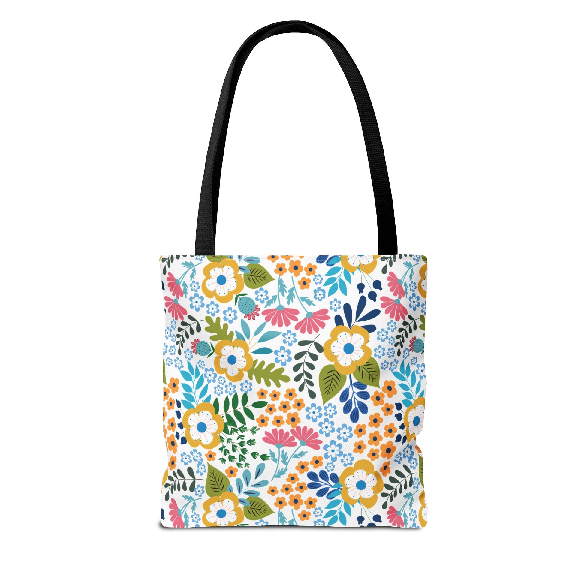 Floral Tote Bag with black straps, featuring a vibrant floral pattern in yellow, pink, blue, and orange on a white background, embodies FireBrook Designs' cheerful style, perfect for summer outings.